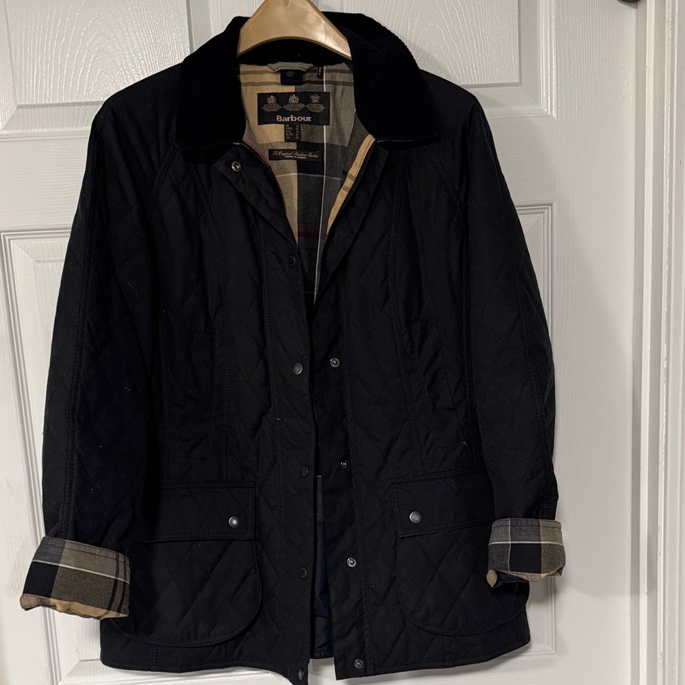 Barbour Black Quilted Coat new without tags. Plaid Accents and corduroy collar.